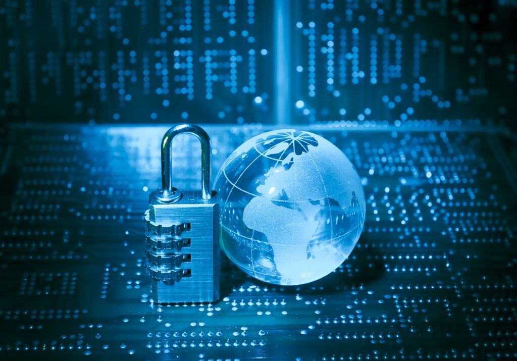 Combination-lock padlock and glass globe on a circuit board symbolizing global cybersecurity.